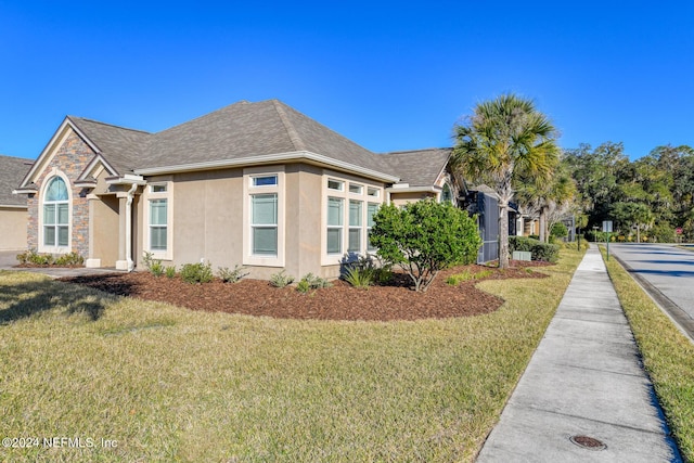 view of front of home with a front lawn