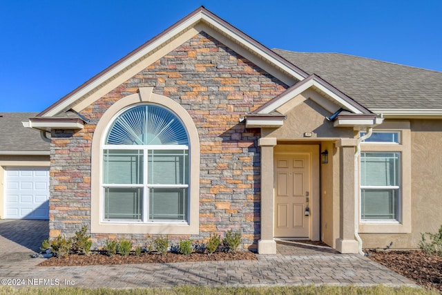 property entrance with a garage