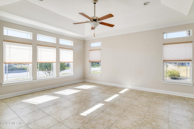 unfurnished room featuring light tile patterned floors, a wealth of natural light, and crown molding