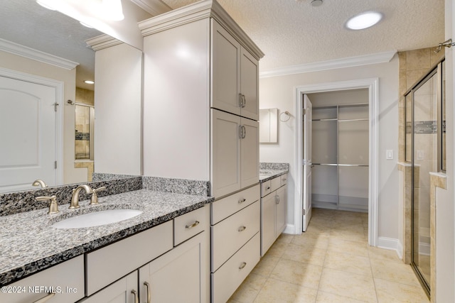 bathroom with tile patterned floors, crown molding, a textured ceiling, and walk in shower