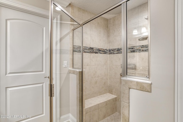 bathroom with tiled shower