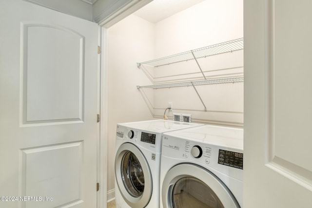 washroom featuring independent washer and dryer