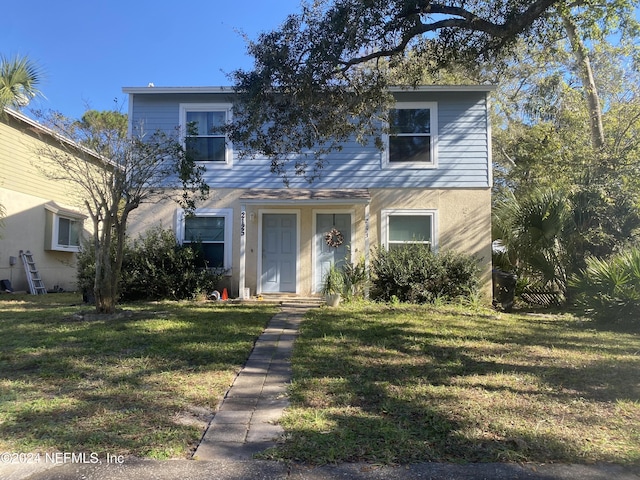 front of property featuring a front lawn