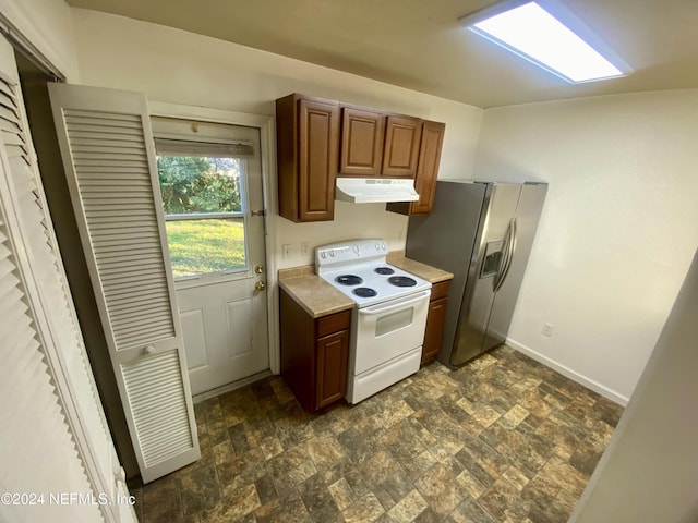 kitchen with stainless steel refrigerator with ice dispenser and white electric range