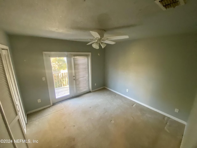 unfurnished bedroom with light carpet, access to exterior, and ceiling fan