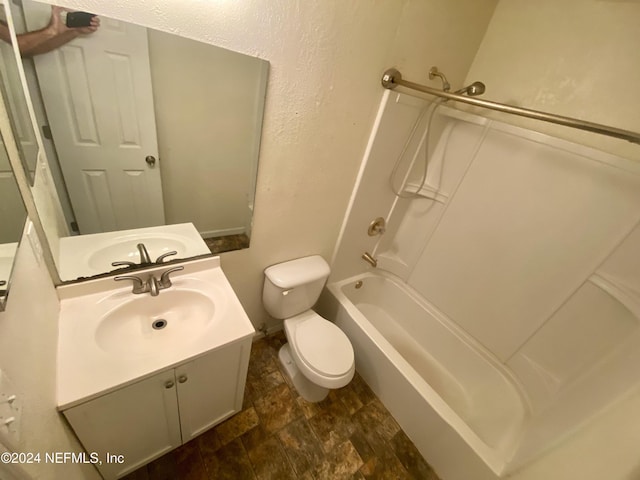 full bathroom featuring vanity, toilet, and washtub / shower combination