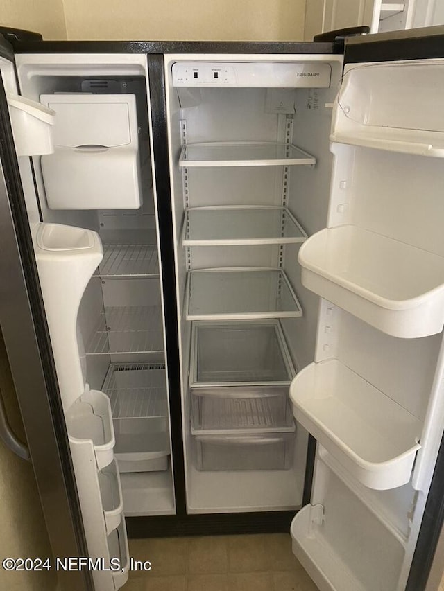 interior details featuring fridge