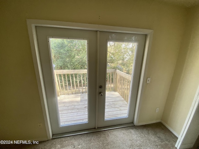 doorway featuring carpet and french doors