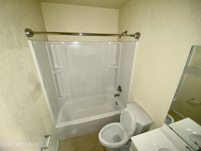 bathroom featuring shower / washtub combination and toilet