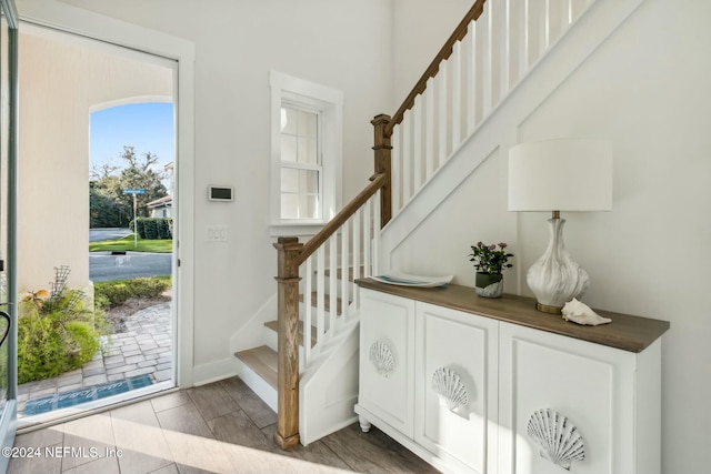 entryway with hardwood / wood-style floors