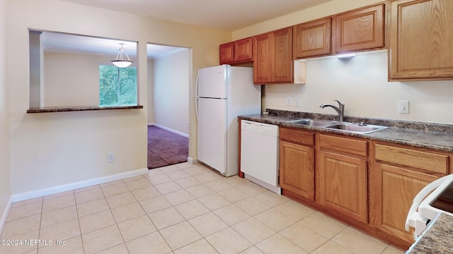 8880 Old Kings Rd S Unit 106, Jacksonville, FL 32257 - kitchen featuring white appliances, dark countertops, brown cabinetry, and light tile patterned floors