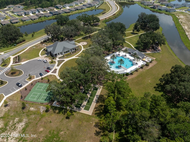 birds eye view of property with a water view