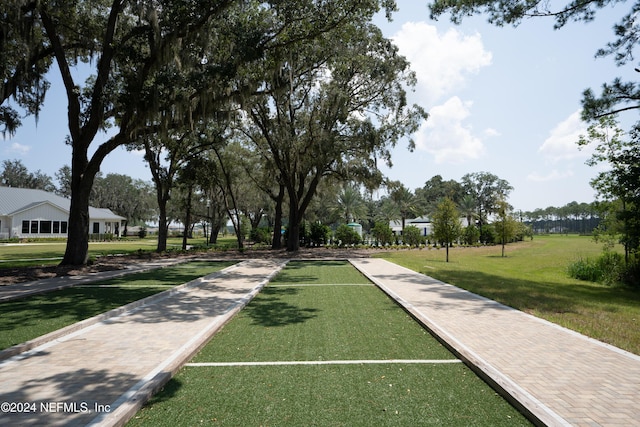 view of property's community featuring a yard