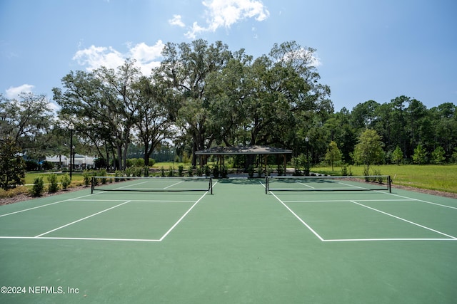 view of tennis court featuring basketball court