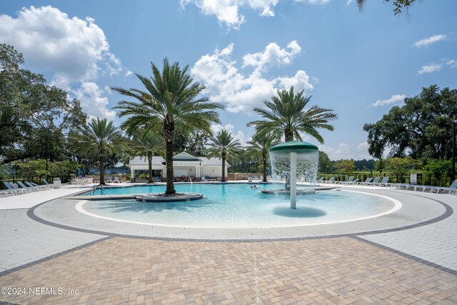 view of pool with pool water feature