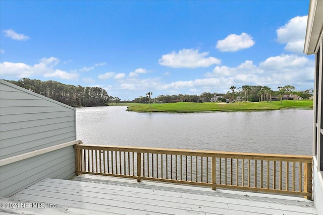 wooden deck with a water view