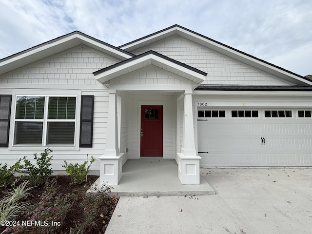 view of front of property with a garage