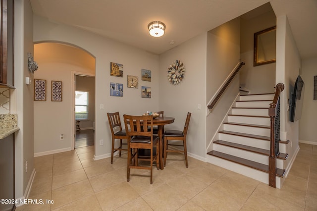 dining area featuring light tile patterned floors