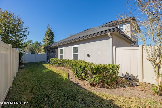 view of home's exterior featuring a yard