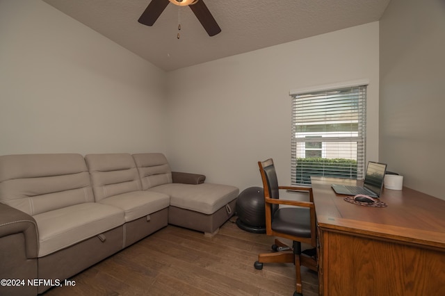 home office featuring hardwood / wood-style floors, a textured ceiling, and ceiling fan