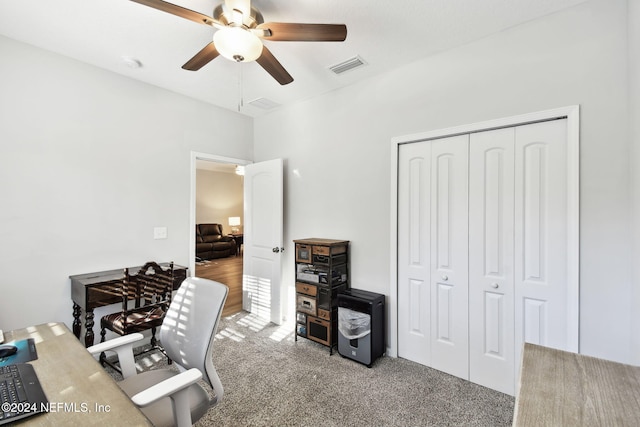 home office with carpet flooring and ceiling fan