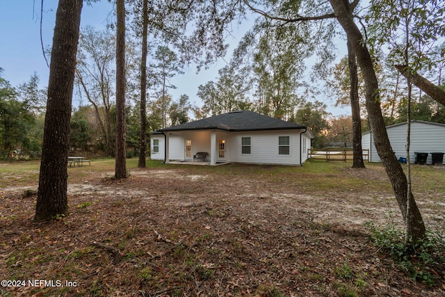 rear view of house featuring a patio area