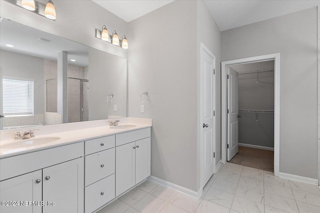 bathroom featuring vanity and an enclosed shower