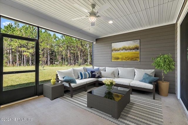 sunroom with plenty of natural light, ceiling fan, and wooden ceiling