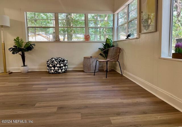 unfurnished room featuring hardwood / wood-style flooring