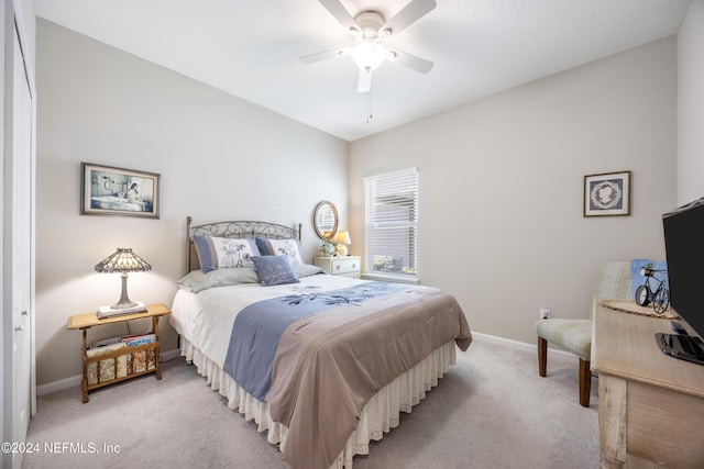 bedroom with ceiling fan and light colored carpet