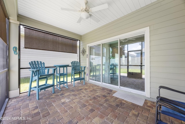 sunroom / solarium with ceiling fan