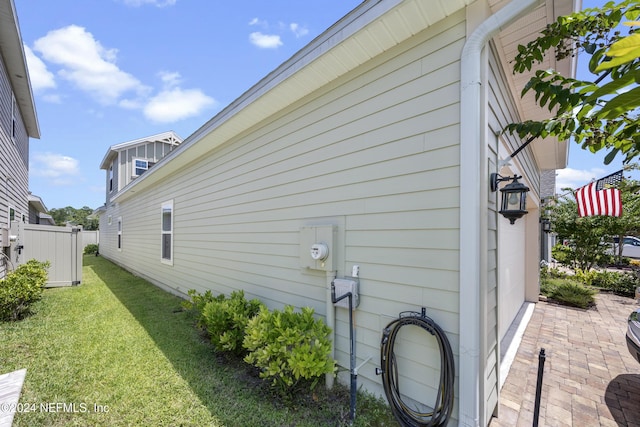 view of side of property with a yard