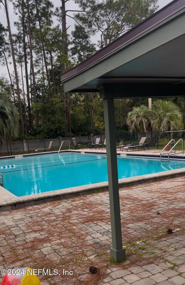 view of pool with a patio