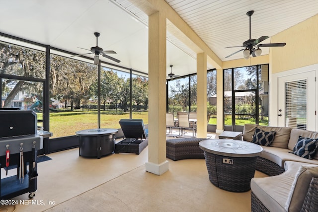 sunroom featuring ceiling fan