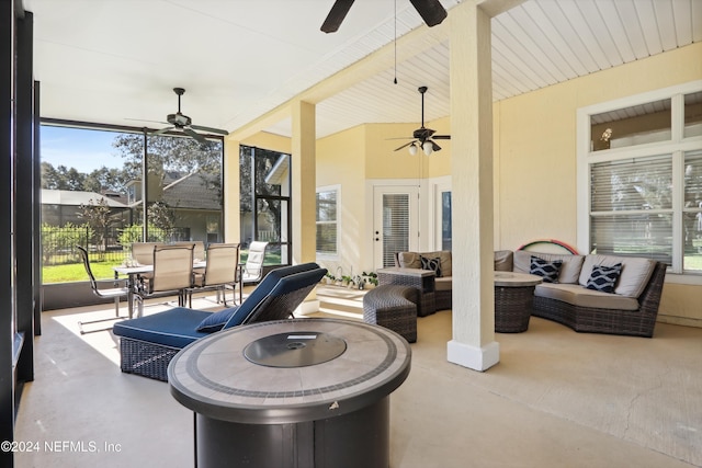 view of patio / terrace with an outdoor living space with a fire pit