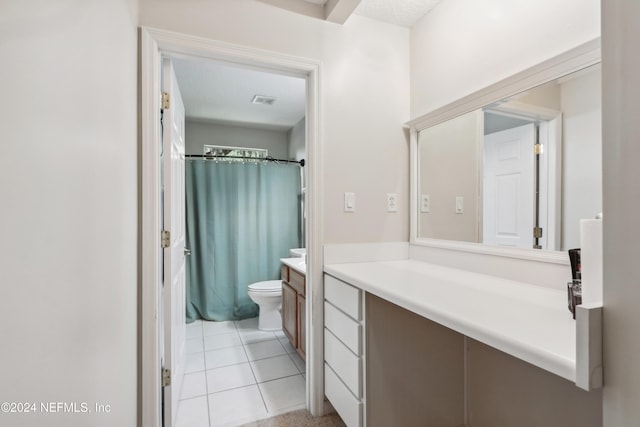 bathroom with a shower with shower curtain, tile patterned floors, vanity, and toilet