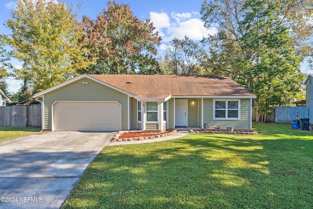 single story home with a garage and a front lawn