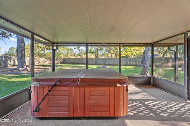 unfurnished sunroom featuring a jacuzzi