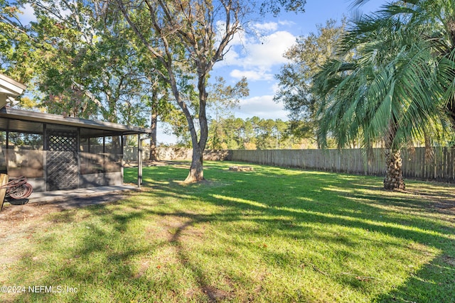 view of yard with a sunroom