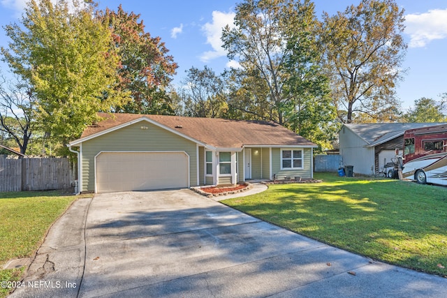 ranch-style home with a garage and a front yard