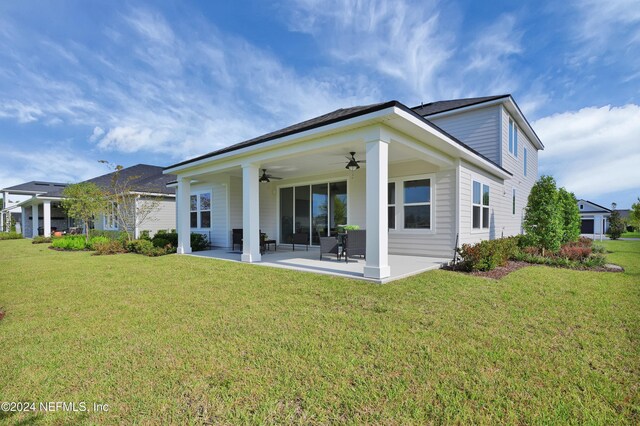 1024 Creighton Rd, Fleming Island, FL 32003 - back of property featuring ceiling fan, a patio, and a yard