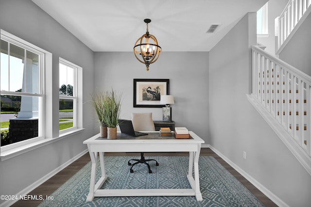 office space with a chandelier and dark hardwood / wood-style floors