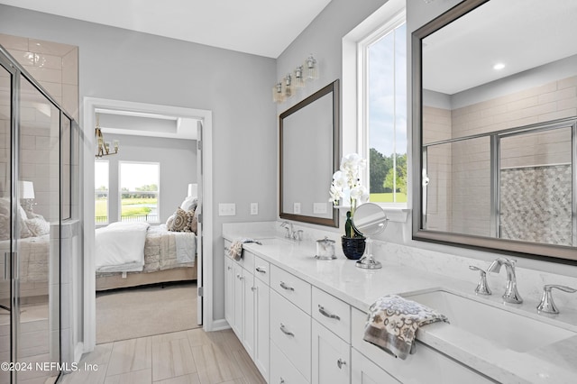 1024 Creighton Rd, Fleming Island, FL 32003 - bathroom with double vanity, a stall shower, ensuite bath, and a chandelier
