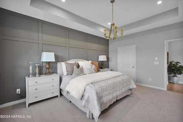 bedroom with carpet and an inviting chandelier