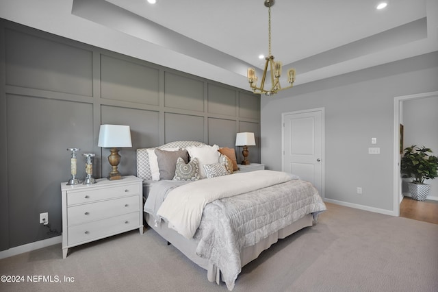 1024 Creighton Rd, Fleming Island, FL 32003 - bedroom featuring carpet, a raised ceiling, a chandelier, recessed lighting, and a decorative wall