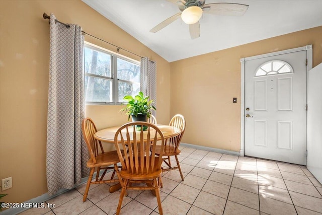 tiled dining room featuring ceiling fan