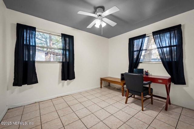 tiled office space with ceiling fan