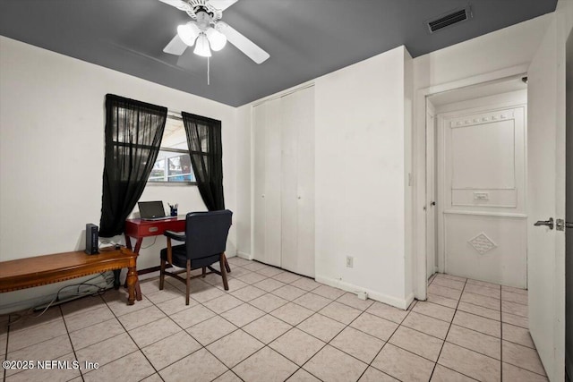 office area featuring ceiling fan and light tile patterned floors