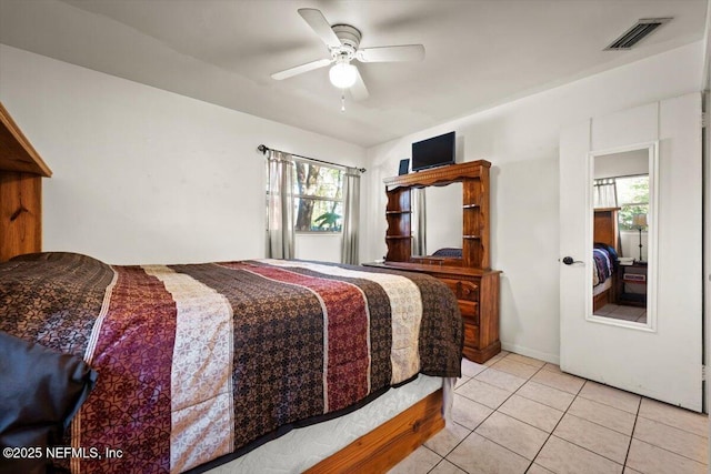 bedroom featuring ceiling fan and light tile patterned floors