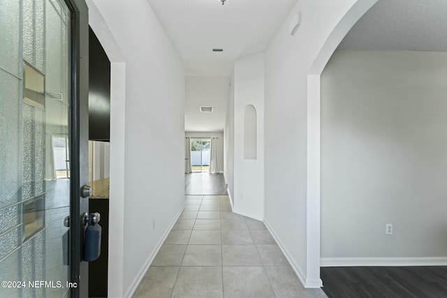 hallway with light tile patterned floors